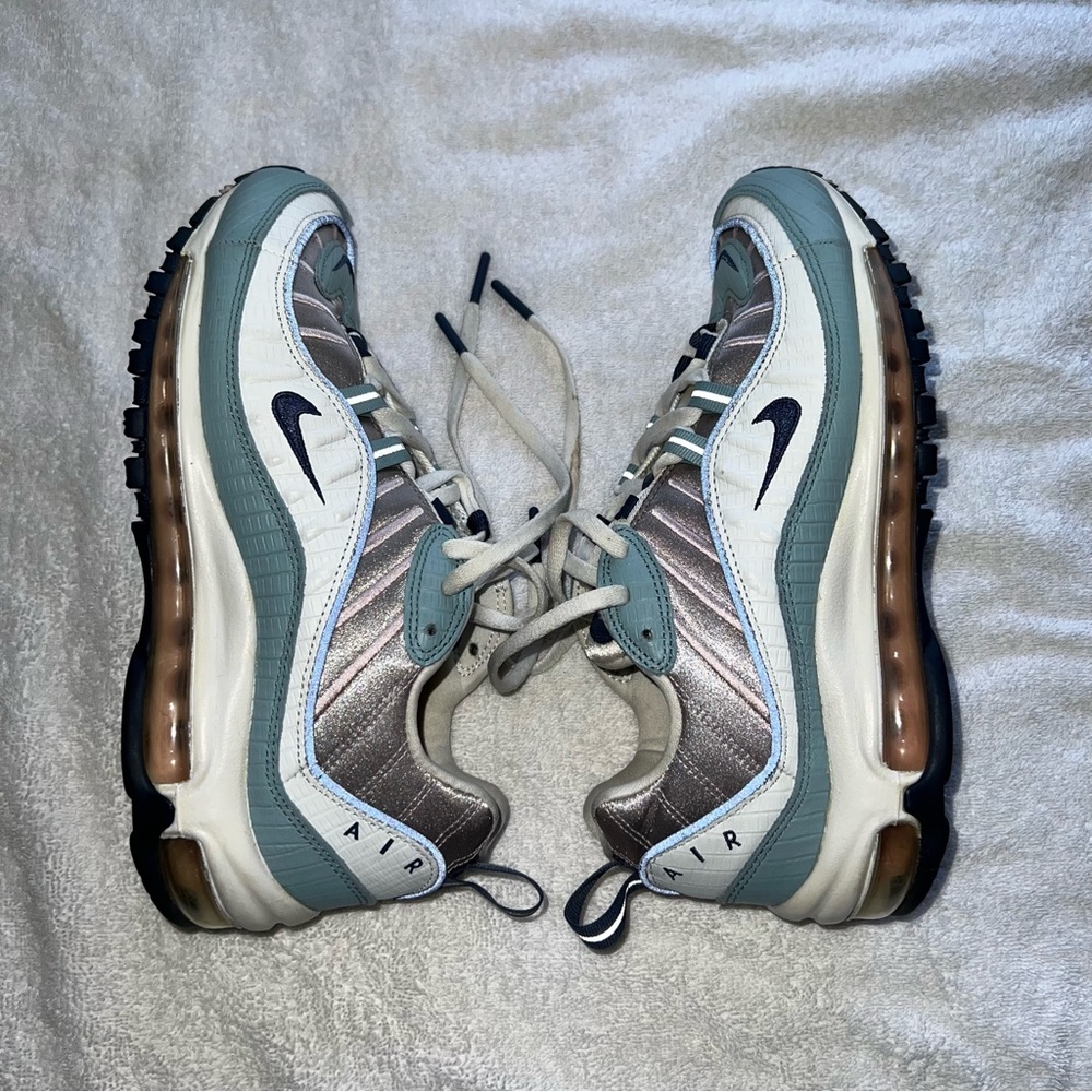 Nike Blue and Silver Sneakers with Thick Soles and Curved Design